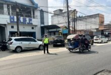 Gelar Kekuatan di Hari Minggu: Sat Lantas Polres Batu Bara Berikan Rasa Aman Selama Ibadah.